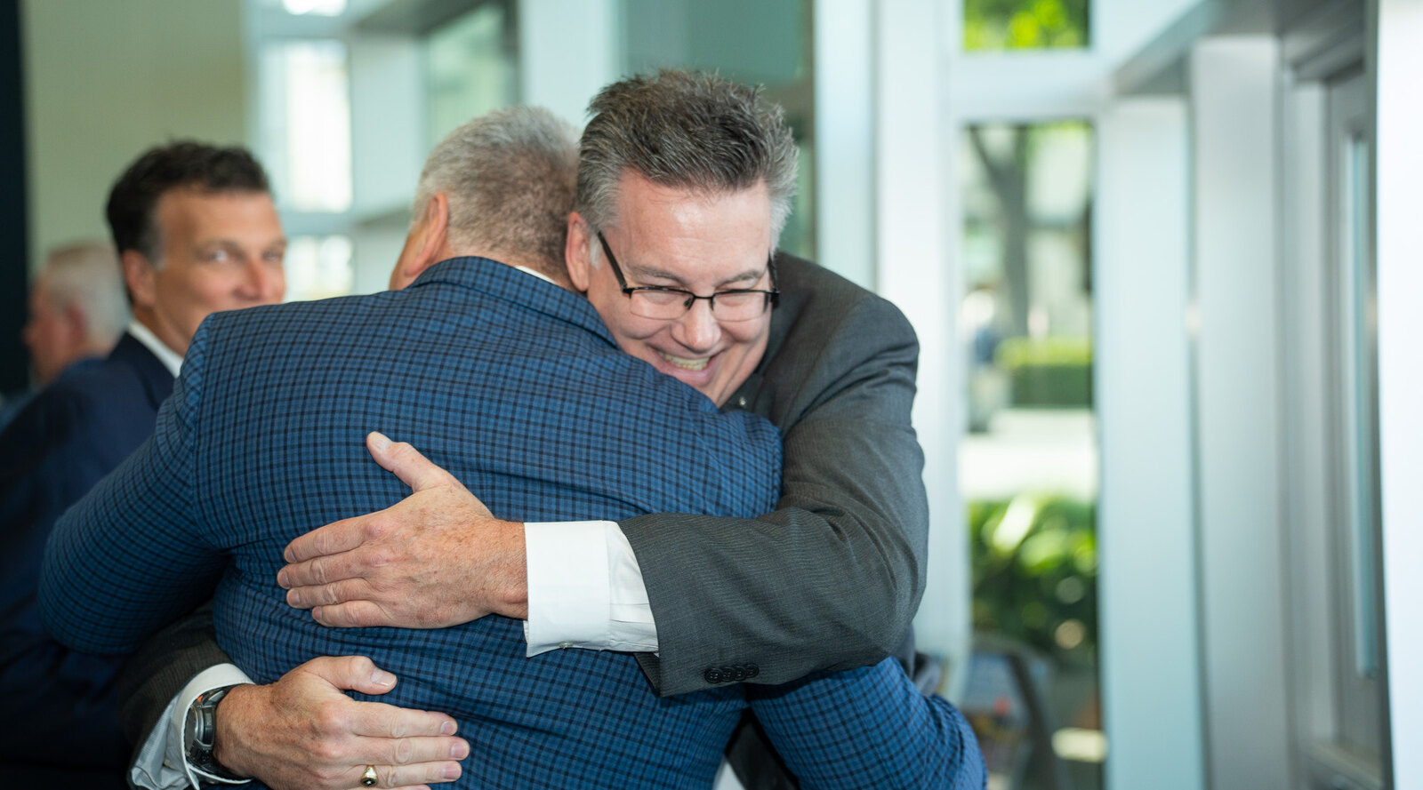 Graduate brothers reconnecting at Pig Dinner